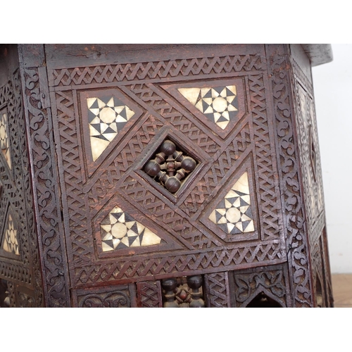 11 - A North African carved hardwood and mother of pearl inlaid hexagonal Table 1ft 10in W x 1ft 9in H