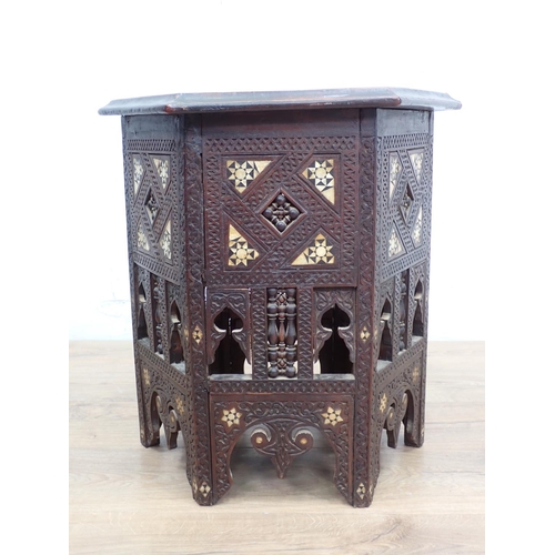 11 - A North African carved hardwood and mother of pearl inlaid hexagonal Table 1ft 10in W x 1ft 9in H