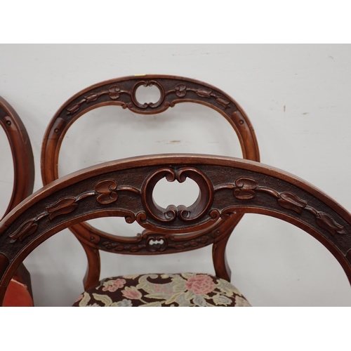 114 - A set of six Victorian walnut balloon back Dining Chairs with floral upholstered seats