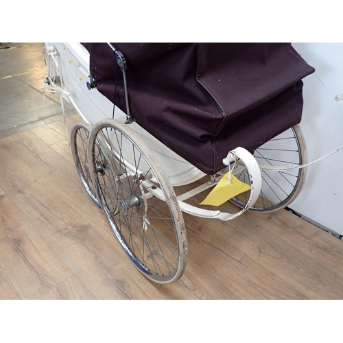 12 - A vintage white Pram with spoked wheels 4ft 5in L