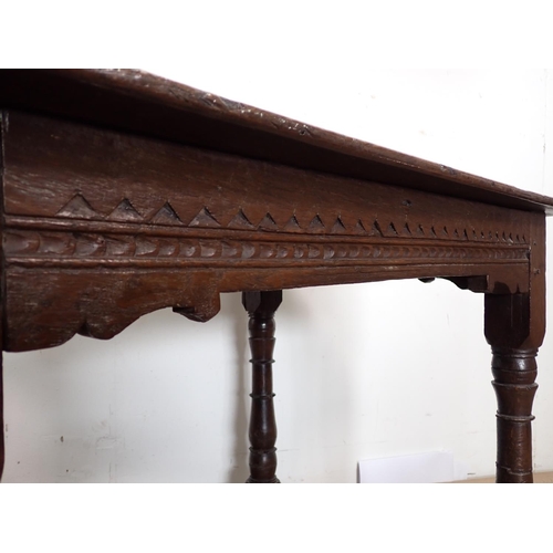 122 - A late 17th Century oak Altar Table with turned supports united by surrounding stretchers 3ft 2in W ... 