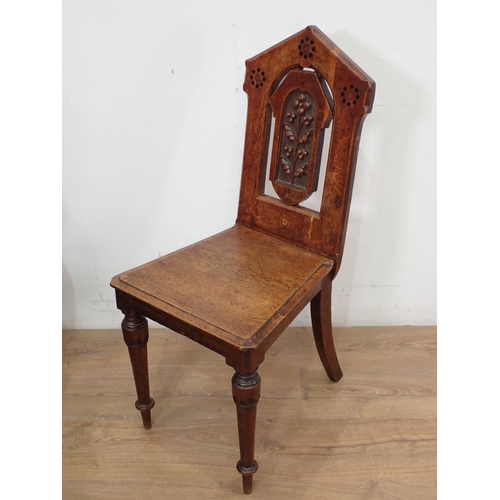 126 - A Victorian oak Hall Chair with carved back and inlay mounted upon turned tapering supports 2ft 10in... 