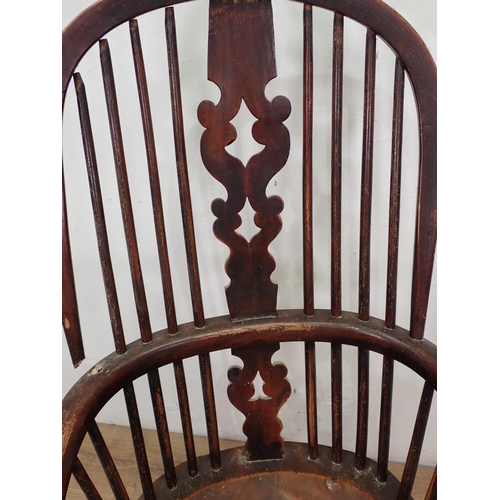 13 - A 19th Century ash and elm Windsor Armchair with pierced splat back on turned supports united by cri... 