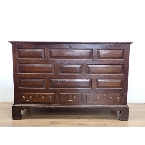 130 - An 18th Century oak Lancashire Chest with hinged lid having later alteration above panel front fitte... 