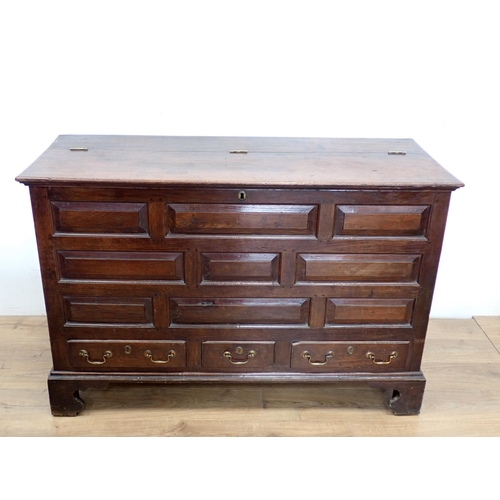 130 - An 18th Century oak Lancashire Chest with hinged lid having later alteration above panel front fitte... 