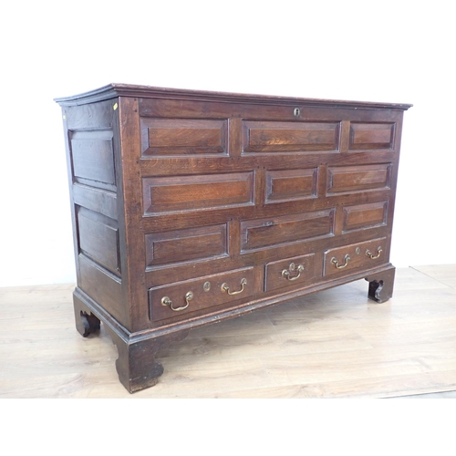 130 - An 18th Century oak Lancashire Chest with hinged lid having later alteration above panel front fitte... 