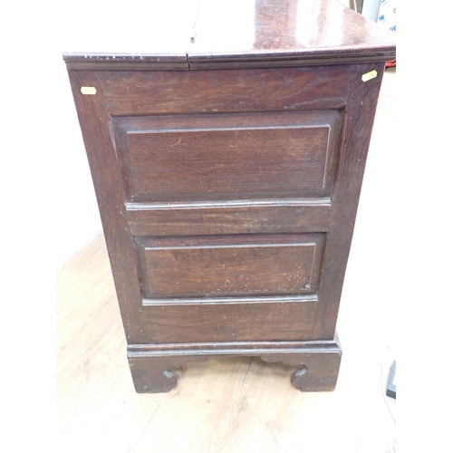 130 - An 18th Century oak Lancashire Chest with hinged lid having later alteration above panel front fitte... 