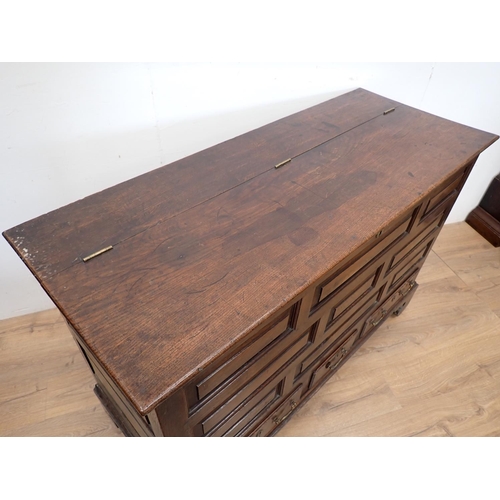 130 - An 18th Century oak Lancashire Chest with hinged lid having later alteration above panel front fitte... 