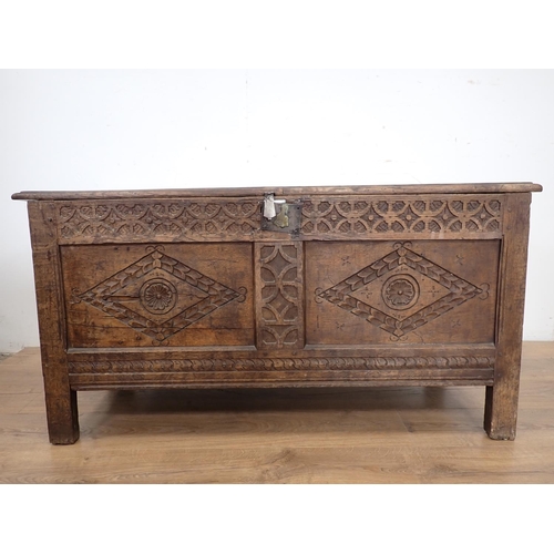 133 - A late 17th/early 18th Century oak Coffer of small proportions with sunken two panel lid above rose ... 