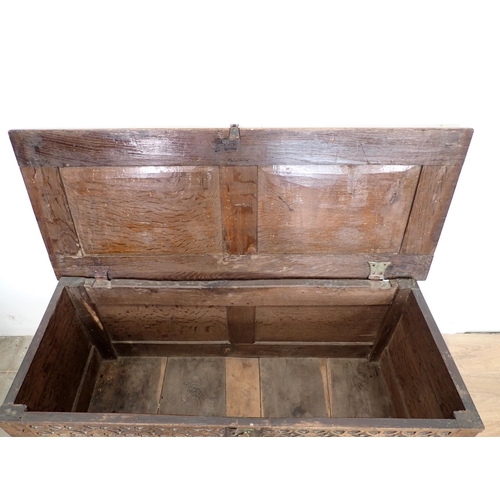 133 - A late 17th/early 18th Century oak Coffer of small proportions with sunken two panel lid above rose ... 