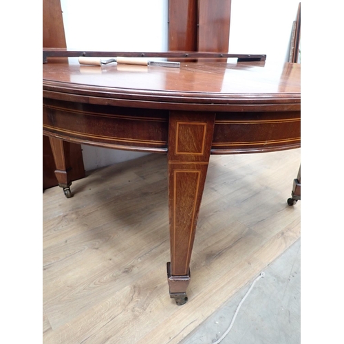 136 - A 19th Century mahogany and inlaid extending Dining Table with five spare leaves mounted upon square... 