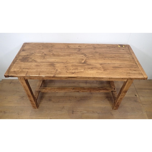 19 - A pine Farmhouse Table with cleated top mounted upon square cut supports and H-stretcher 4ft 10in W ... 