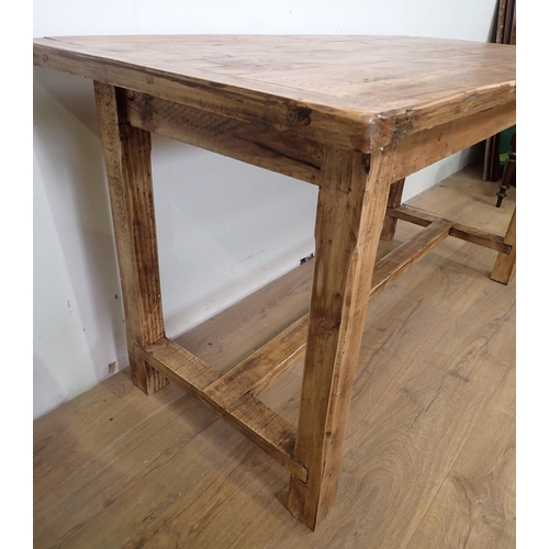 19 - A pine Farmhouse Table with cleated top mounted upon square cut supports and H-stretcher 4ft 10in W ... 