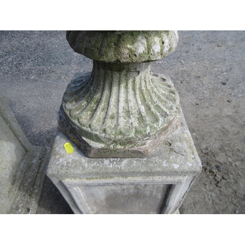 313 - A pair of moulded concrete Urns on plinths, 3ft 1in H