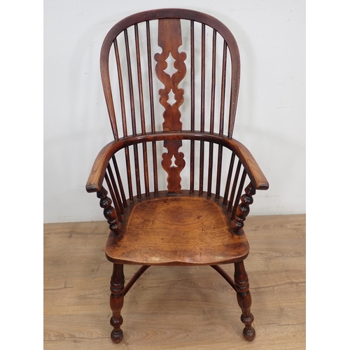 39 - A 19th Century ash Windsor Armchair mounted upon turned supports united by crinoline stretcher 3ft 8... 