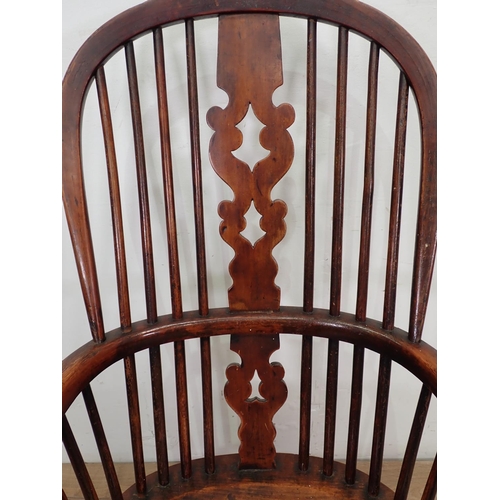 39 - A 19th Century ash Windsor Armchair mounted upon turned supports united by crinoline stretcher 3ft 8... 