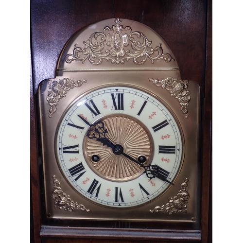 391 - A walnut cased American Wall Clock with eagle surmount 3ft 10in