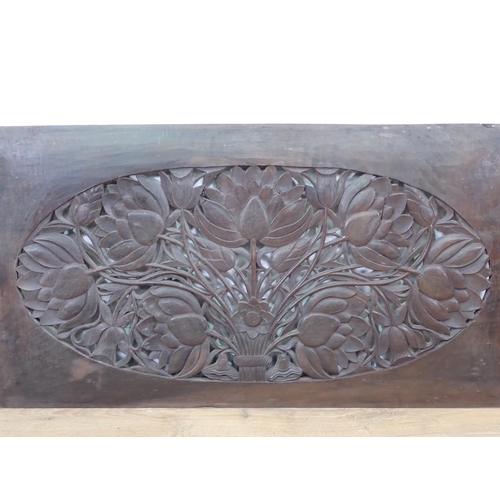 394 - An Eastern hardwood carved and pierced Panel decorated with flowers 3ft 4in W x 1ft 10in H