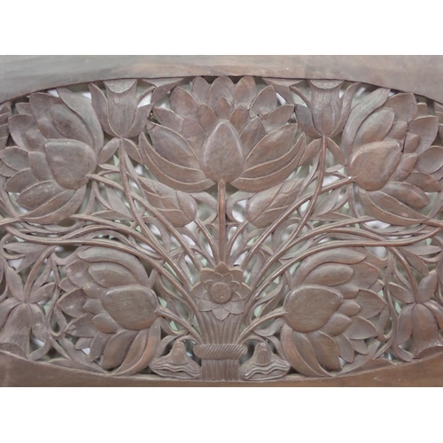 394 - An Eastern hardwood carved and pierced Panel decorated with flowers 3ft 4in W x 1ft 10in H