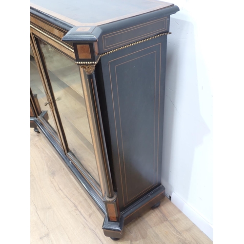 404 - A Victorian walnut and ebonised Bookcase fitted pair of glazed doors enclosing adjustable shelves mo... 