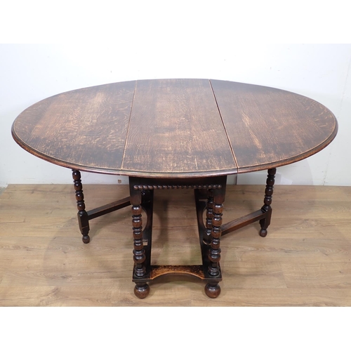 412 - A 20th Century oak gateleg Table on turned supports and bun feet 3ft 8in W x 2ft 5in H