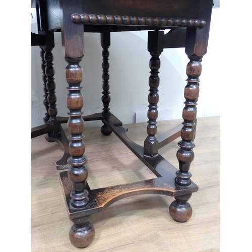 412 - A 20th Century oak gateleg Table on turned supports and bun feet 3ft 8in W x 2ft 5in H