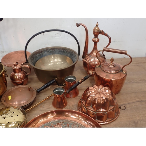 421 - A quantity of brass and copperware including Jam Pan, Jelly Mould, Wine Bucket, Charger, Measures, e... 