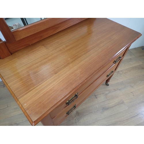 423 - A walnut Dressing Chest by Arthur Romney Green (Cotswold School) fitted two drawers on turned caster... 