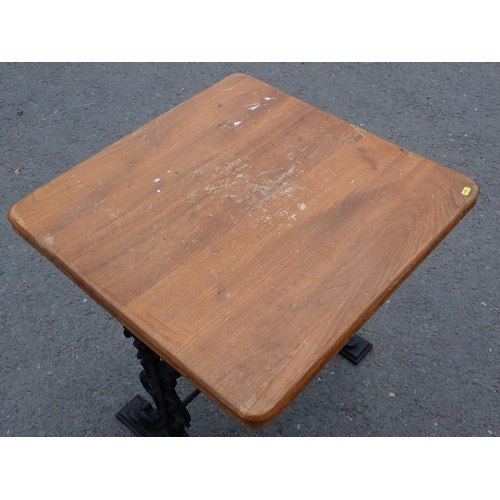 442 - An elm topped Pub Table on cast iron base 2ft 4in H x 2ft 3in W