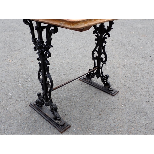 443 - An elm topped Pub Table on cast iron base 2ft 4in H x 2ft 3in W