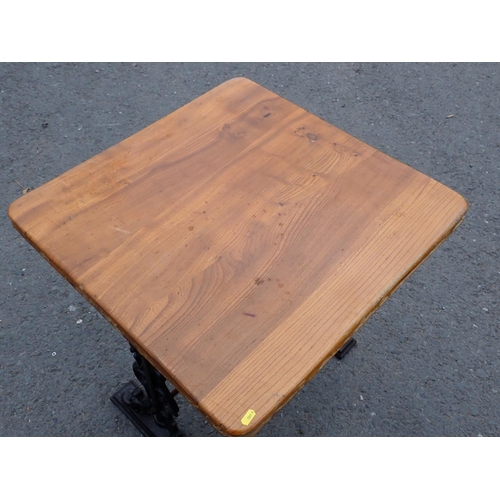 443 - An elm topped Pub Table on cast iron base 2ft 4in H x 2ft 3in W