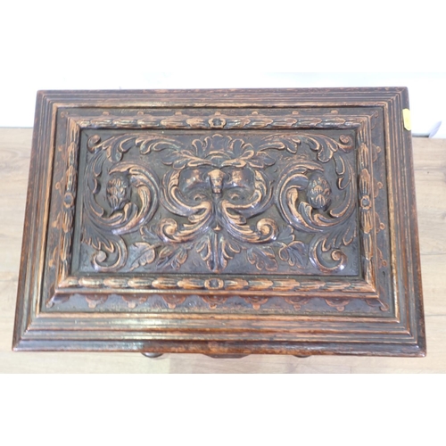 5 - A 19th Century oak Teapoy with carved green man and leafage design 2ft 8in H x 1ft 5in W