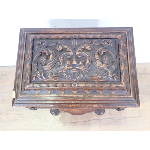 5 - A 19th Century oak Teapoy with carved green man and leafage design 2ft 8in H x 1ft 5in W