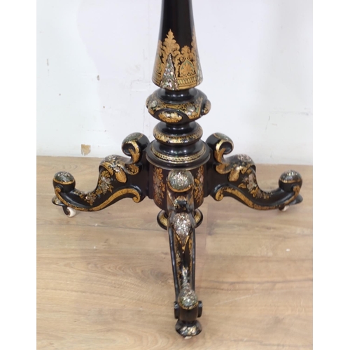 52 - A 19th Century lacquered and mother of pearl inlaid Games Table on tripod base and ceramic casters 2... 