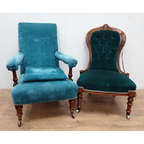 68 - A 19th Century mahogany framed blue upholstered Easy Chair on turned front supports and brass caster... 