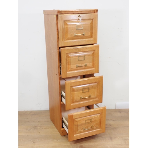 75 - A modern oak Filing Cabinet 4ft 3in H x 1ft 4in W