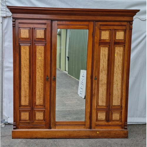 812 - A Victorian walnut triple Wardrobe with central mirror door 6ft 8in H x 6ft 5in W