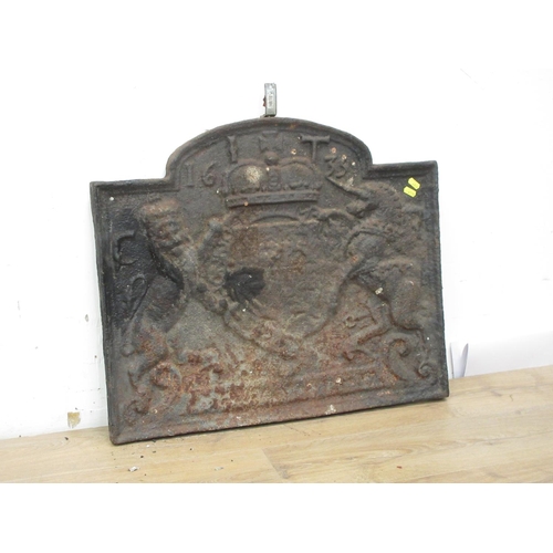 815 - A cast iron Fire Back in the 17th Century style 2ft 2in W x 1ft 10in H