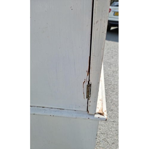 818 - A painted oak Linen Cupboard with two doors above two short and two long drawers 6ft 10ins H x 4ft 2... 