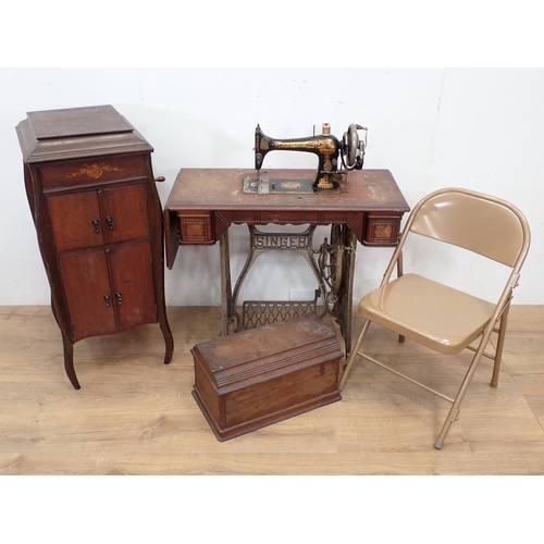 93 - A Sewing Machine on stand, mahogany and inlaid Gramophone Cabinet and a folding Chair