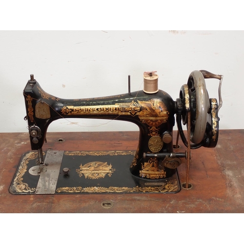 93 - A Sewing Machine on stand, mahogany and inlaid Gramophone Cabinet and a folding Chair