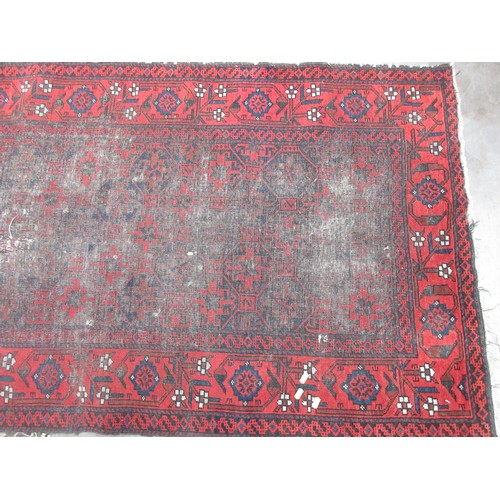 3 - A red ground Persian Rug (heavily worn) 6ft 2in L x 3ft 3in W and a small pink Rug 4ft 1in L x 2ft 5... 