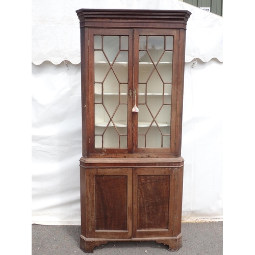 813 - A Georgian oak and astragal glazed standing Corner Cabinet fitted pair of cupboard doors to base on ... 