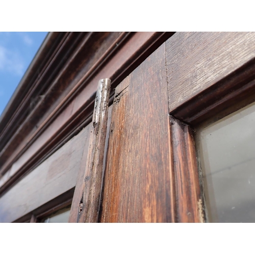 813 - A Georgian oak and astragal glazed standing Corner Cabinet fitted pair of cupboard doors to base on ... 