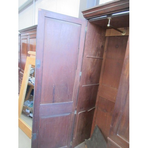 810 - A Victorian mahogany breakfront four door Wardrobe fitted to short and two long drawers to central s... 