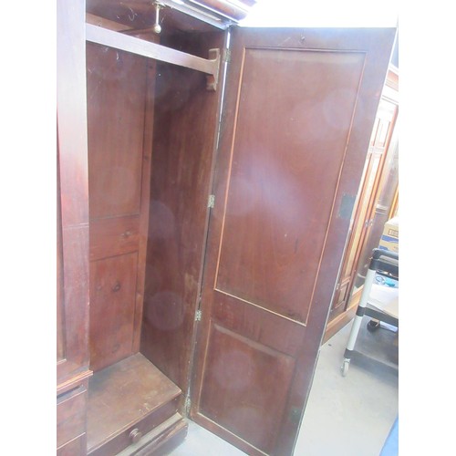 810 - A Victorian mahogany breakfront four door Wardrobe fitted to short and two long drawers to central s... 