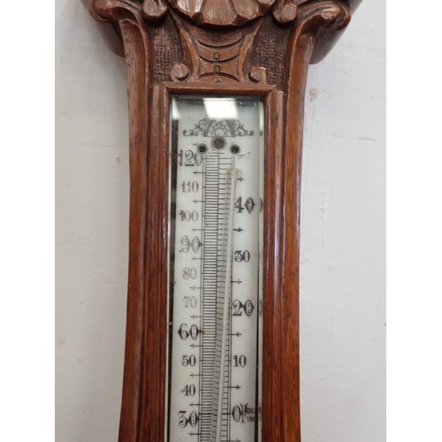 47 - A Victorian carved oak aneroid Barometer A/F 2ft 11in L