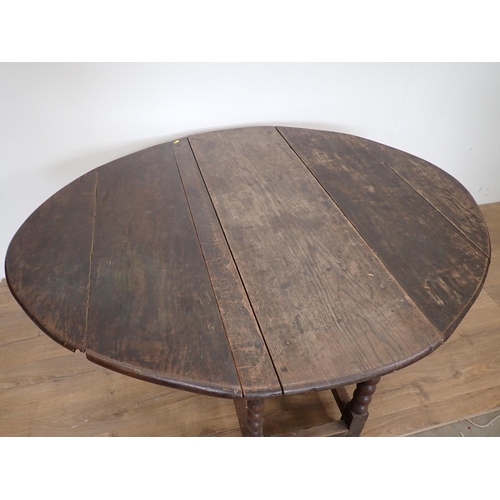 101 - An antique oak Gateleg Table mounted on bobbin turned supports 4ft 1in W x 2ft 5in H