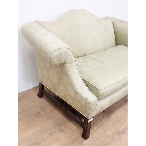 135 - A Georgian style humpback Settee with green floral upholstery mounted upon square cut supports 4ft 1... 