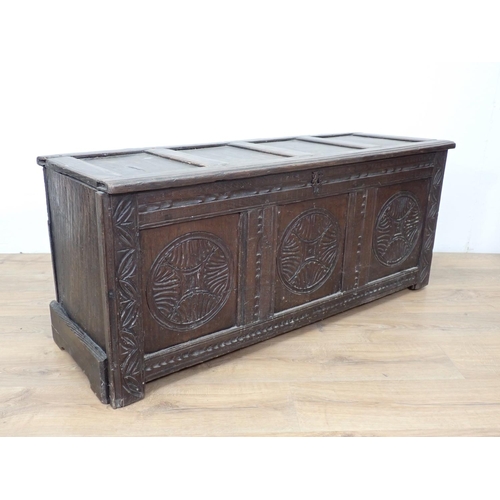 148 - A 17th Century oak Coffer with sunken four panel lid above carved front 3ft 11in W x 1ft 9in H